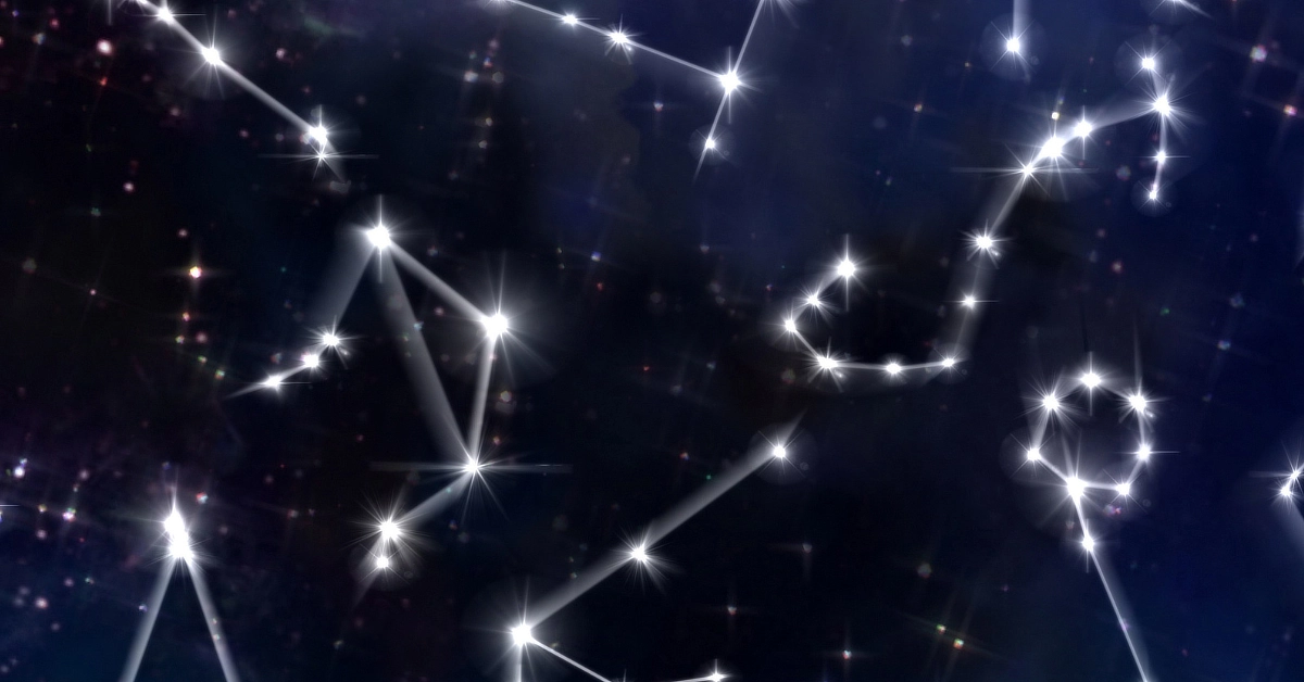 A night sky with bright stars connected by lines to form various constellations against a dark, starry background.