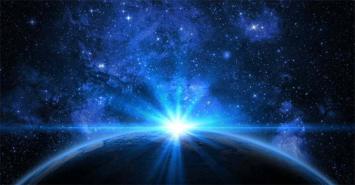 A view of Earth from space with a bright blue light shining over the horizon against a backdrop of stars and a deep blue galaxy.