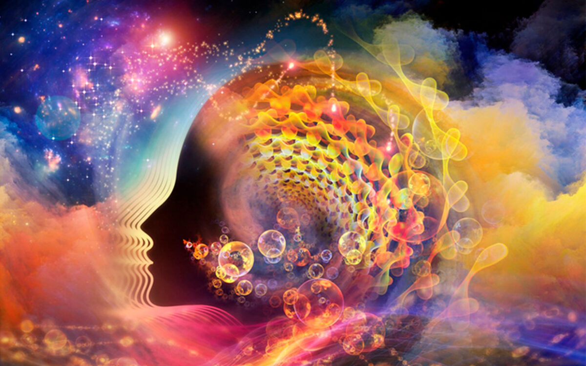 A vibrant, abstract image depicting a profile of a human face blending into a cosmic scene. The artwork features swirling colors, bubbles, and a spiral of light, representing the universe and consciousness.