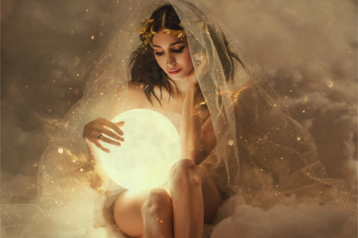 Gorgeous slender sexy lady sits in the clouds and holds the moon in her hands. daughter of the sun and sky, keeper of dreams, ready to do good and a fairy tale under the cover of night and the stars.